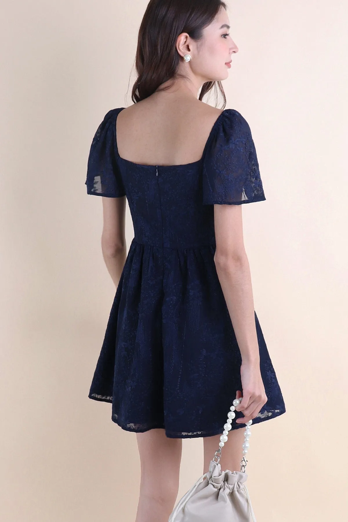 FIDELIA FLUTTERS CUT-OUT DRESS IN NAVY