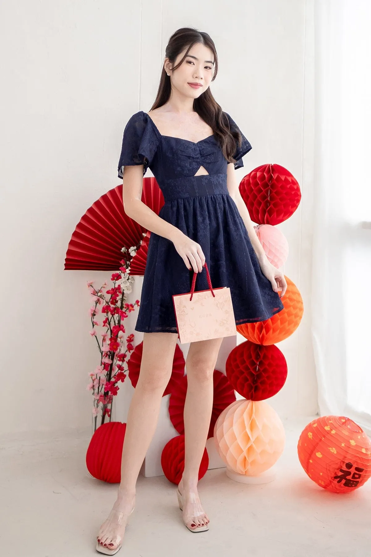 FIDELIA FLUTTERS CUT-OUT DRESS IN NAVY