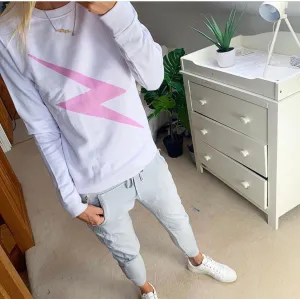 Skinny pink lightning strike on white sweatshirt